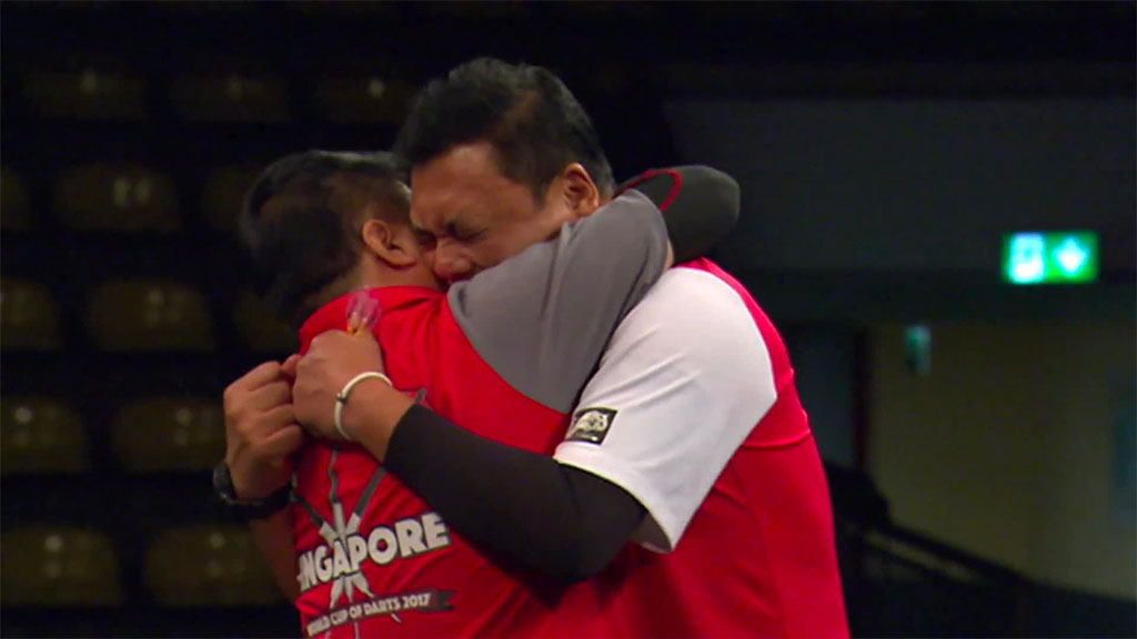 Singapore celebrate their shock win over Scotland in the opening night of the 2017 PDC World Cup of Darts. Photo Credit: Sky Sports.