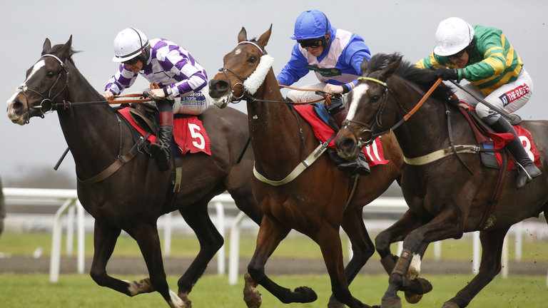 Darren's first pick of the day - River Frost ridden by Barry Geraghty (right) leads Expedite ridden by Tom Cannon in his last race.